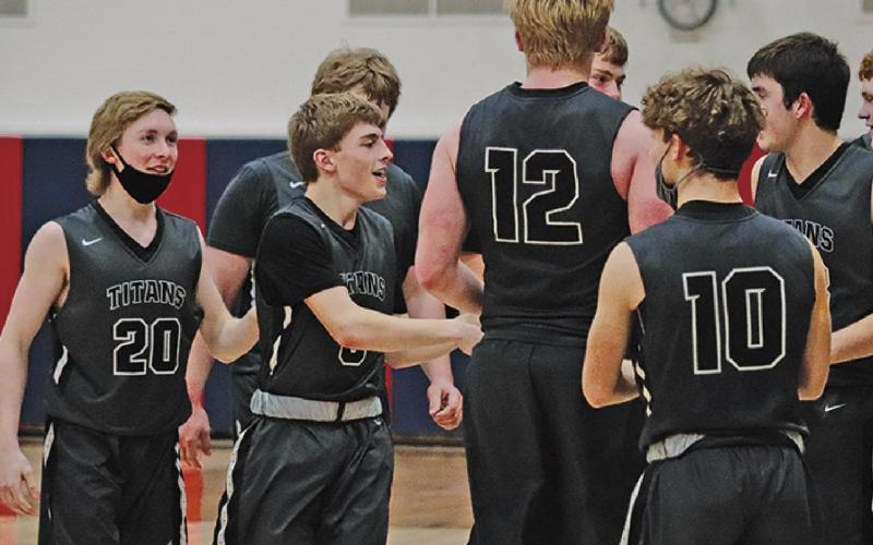 Titans celebrate their win following the Region II play in game in Hope. VNV Photo by Lesa Van Camp