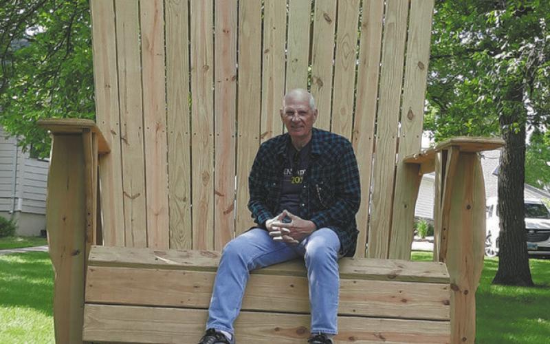 Clint sitting in the camp chair near the Chapel. Photo by Lyle Van Camp.