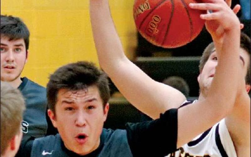 Gage Pollestad and Seth Nelson fight for possession of the ball during the double header Monday night in Park River against the Aggies. VNV Photo by Lesa Van Camp
