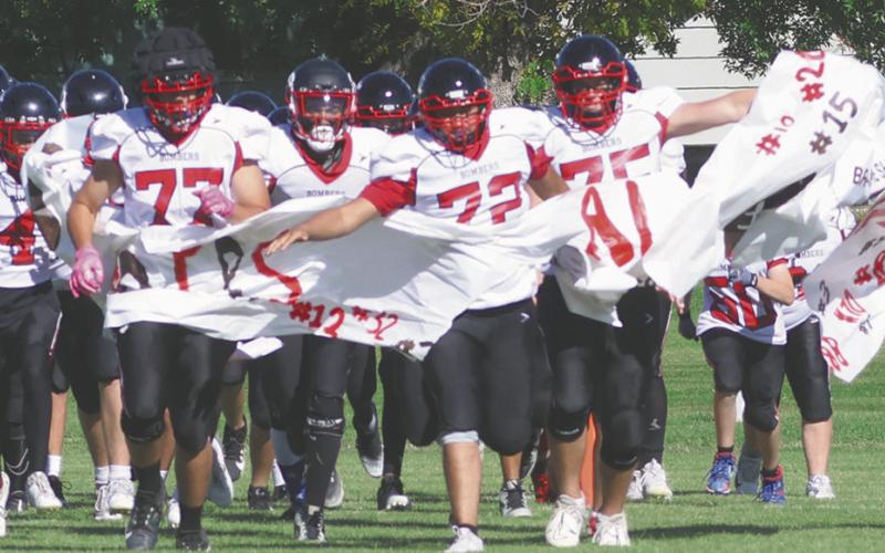 The Bombers take to the field to start the final regular season home game of the season. Photo by Lyle Van Camp
