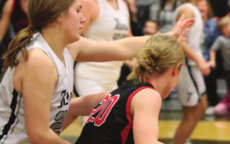 Kiara Aasand puts pressure on the Ball handle in action against Midway-Minto. Photo provided by Drayton Public School - Darla Hoyles