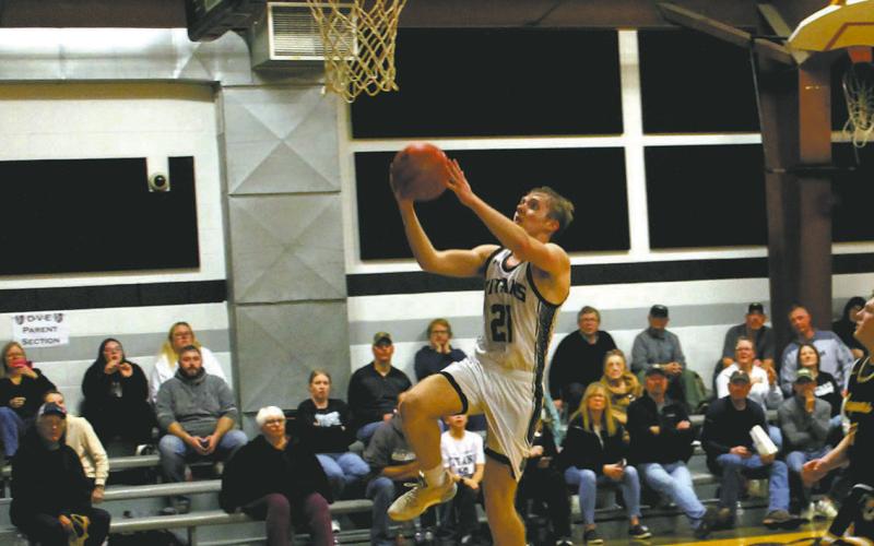 DVE sophomore Carter Oberg goes up for the basket. Photo by Jamie Rarick
