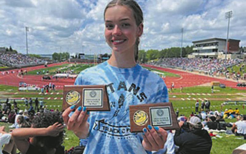 Elizabeth Fedji crushed the 24 year DPS standing record in the 400 dash. Photo by Jeryl Thompson