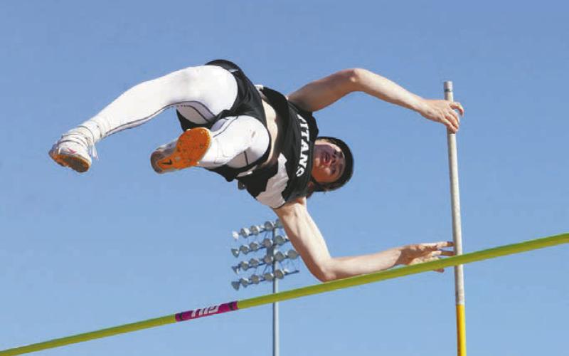 Grant Vold dominated the pole vault height of 10’6” Photo by Larry Stokke.