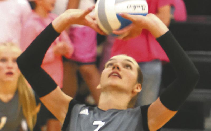 Elizabeth Fedje puts up a set in action against May-Port_CG. Photo by Lyle Van Camp