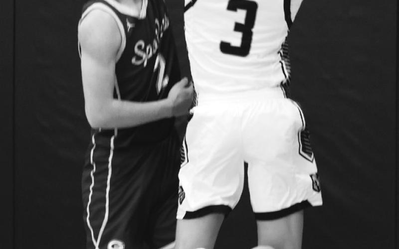 Calvin Otto tries to shoot over Grafton's Tony Villarreal. Photo by Lyle Van Camp.