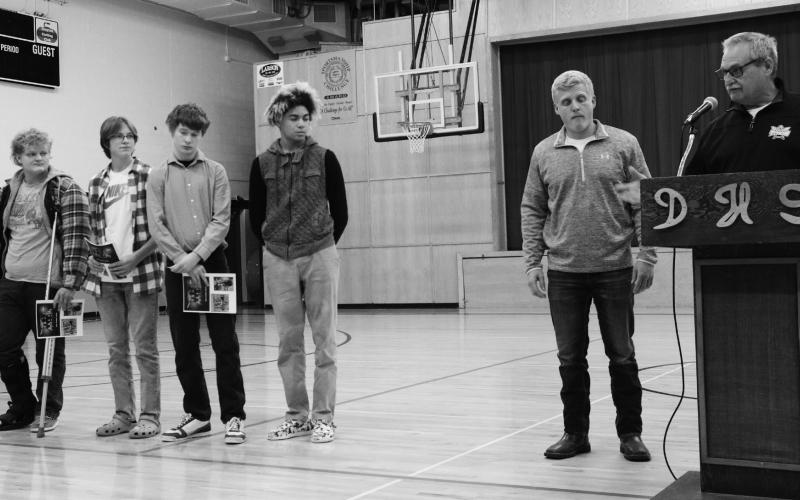 Boys’ track, from left to right: Bryce Wimpfheimer, Jonathan Knutson, James Larocque, Mason Pollestad, Coach Tucker, Coach Thompson. Photo by Lyle Van Camp.