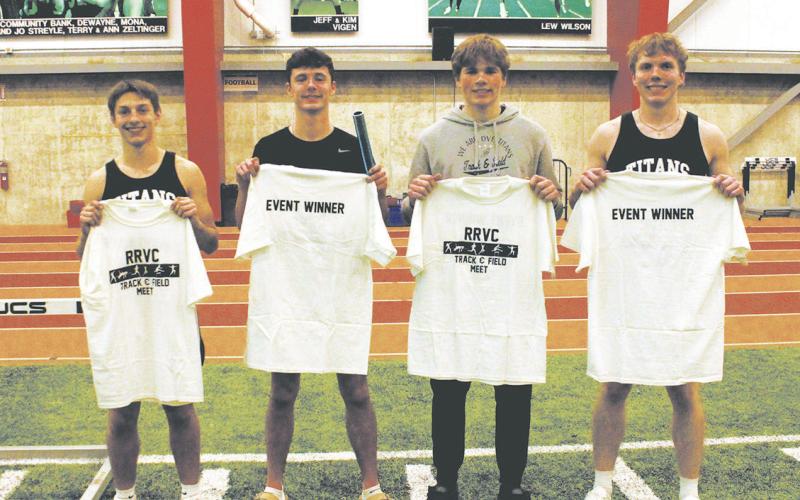 Members of the 4x300 relay team: Carter Johnson, Brady Reilly, Sam Kittelson, and Carter Oberg pose with their t-shirts awarded to all event winners. The team finished 1st with a new school record of 2:36.56. Photo by Jamie Rarick