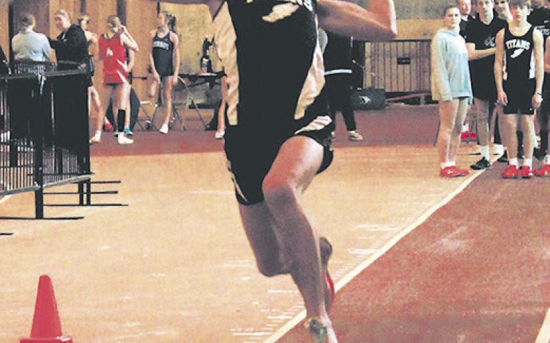 DVE senior Brady Reilly launches forward during the boys long jump competition. Reilly set a personal record at 17' 9' and finishing 6th for the event. Photo by Jamie Rarick