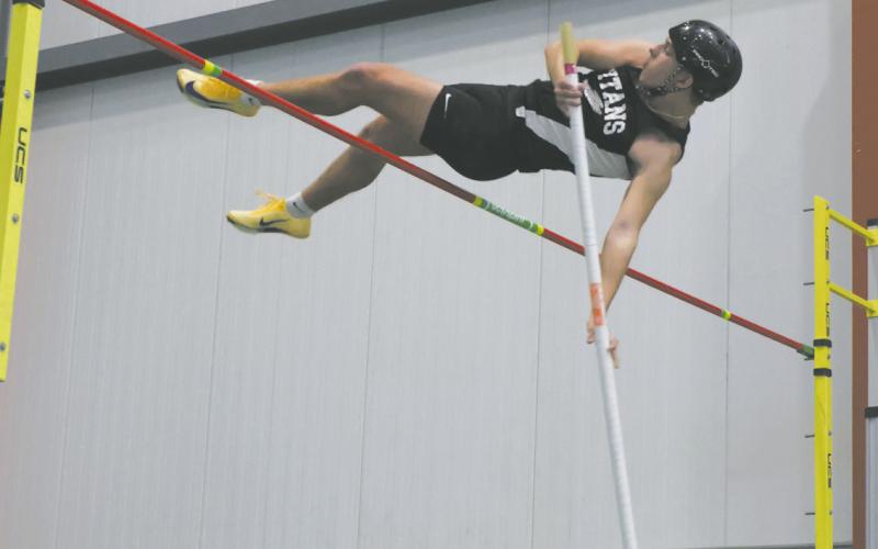 DVE junior Carter Johnson clears the bar in pole vault, winning the meet with a personal best of 11' 3'. Photo by Jamie Rarick