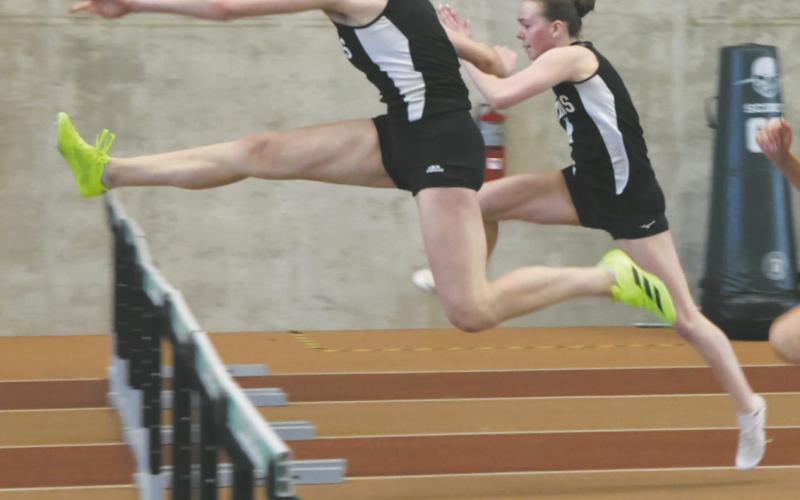 DVE's Elizabeth Fedje pulls ahead of teammate Jocelyn Vold and Langdon Area's Meggy Hetletved to win the Women's 60m Hurdles with a personal best of 9.84. Vold was a close second with a personal best of 10.05. Photo by Jamie Rarick
