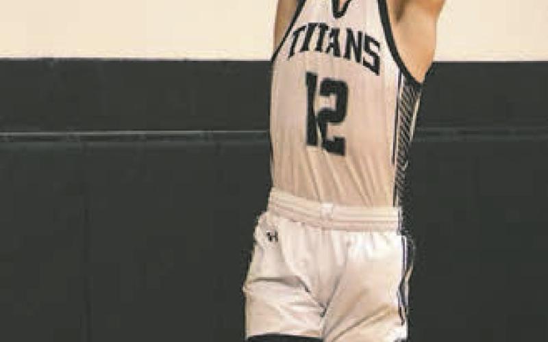 Everett Fedje puts down a dunk against Hatton-Northwood.
