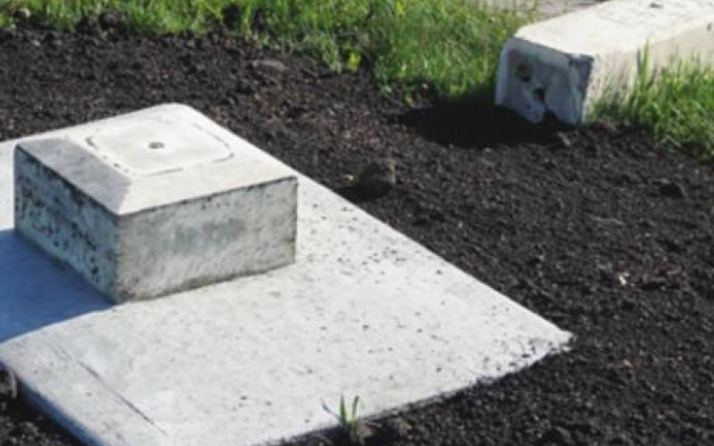 The base of one of the older markers has been rebuilt and is just waiting for the marker to be remounted. VNV Photo by Lyle Van Camp