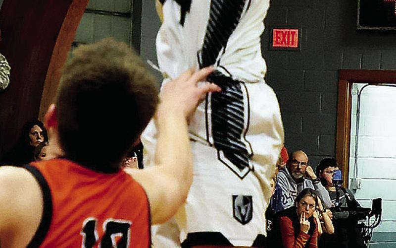 Going vertical, DVE senior Jack Langerud makes the shot over Cavalier defender Carson Stauffenecker. Photo by Jamie Rarick