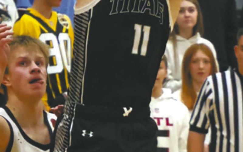 DVE senior Isaac Feltman goes airborne for the shot in Park River Jan. 6. Photo by Jamie Rarick