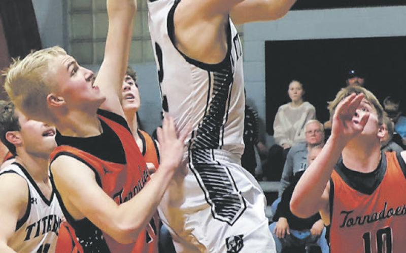 Making it past a strong Tornado defense, Titan Teddy Otto moves in for the layup Jan. 9. Photo by Jamie Rarick