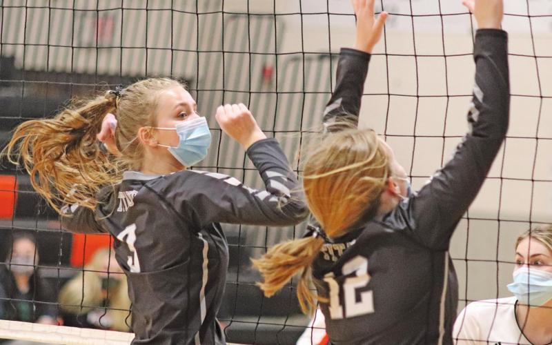 Chloe Gemmill and Aleah Pokrywinski go up for the block against the Cavalier Tornados last Friday night. VNV Photo by Lesa Van Camp