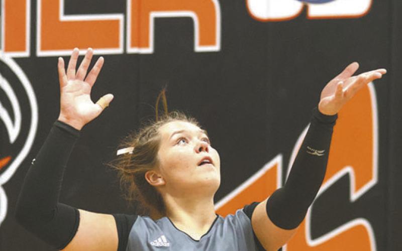 Brooke Gullickson serves against the Tornadoes. Photo by Lyle Van Camp
