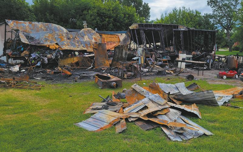 The trailer home at 104 Oak Drive in Grafton was destroyed by a fire in the early morning hours of Thursday, June 24. An adjacent trailer home was also severely damaged. Crews from Grafton and Park River battled the blaze for about four hours. Photo by Mike Allan Steinfeldt
