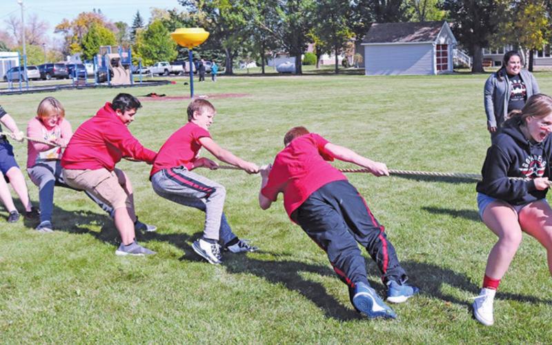 A group of eighth graders play tug of war during the Homecoming events on Friday afternoon to wind down Homecoming week. Photo submitted by Drayton Public School
