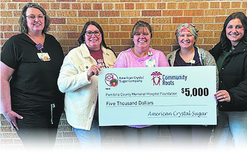 Hannah Peterson, ACSC representative (far right) presents PMCH staff with a check for $5,000 as part of Community Roots. Pictured L-R: Dawn Falk, DON; Becky Coffield, PCMH Foundation Director; Lisa LeTexier, CEO; Amanda Horsley, ER/OR and Hannah Peterson, ACSC representative. Submitted photo