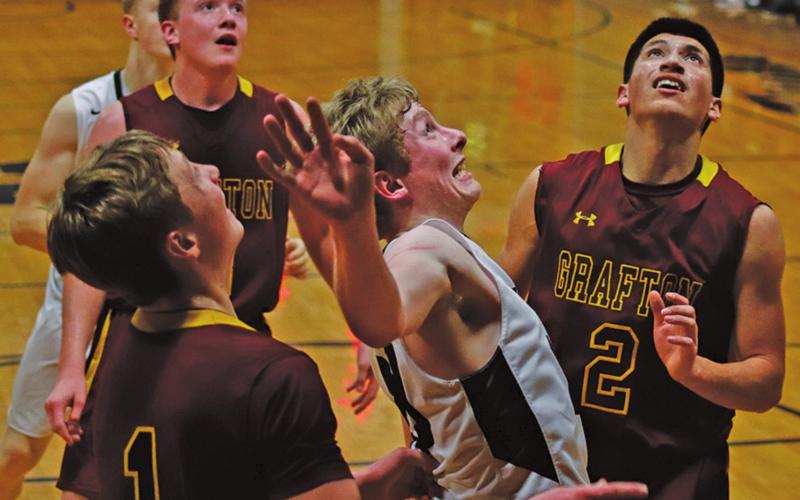 Lucas Anderson boxes out for the rebound against the Grafton Spoilers in the Crystal gym Friday night. VNV photo by Lesa Van Camp