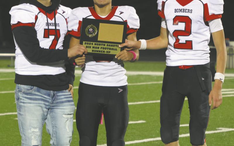 Team captains, Hunter Johnson, Trenten Bronson-Keena with the second place plaque. Photo by Lyle Van Camp