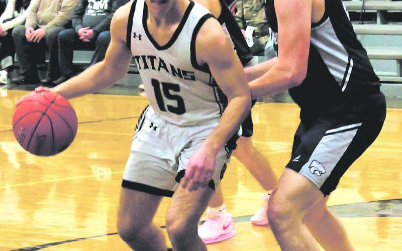 Pushing forward, DVE junior Isaac Feltman fights against a North Prairie defender. Photo by Jamie Rarick