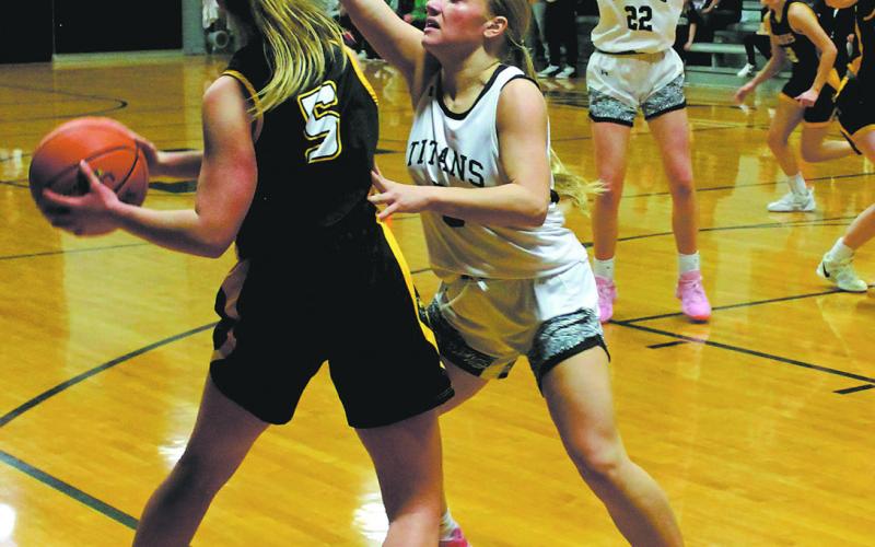 Titan senior Reese Fering puts up strong defense against Aggies senior Madison Bernhoft. Photo by Jamie Rarick