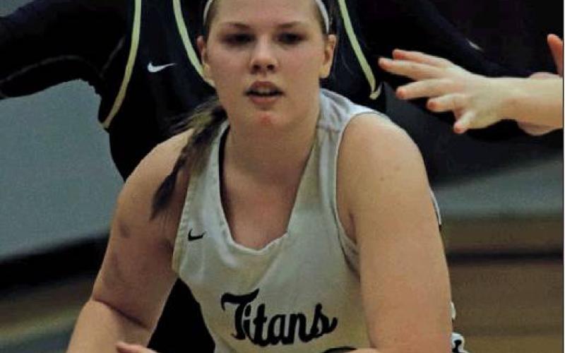 Kasey Stegman looks for an open Titan before being surrounded by Eagles on Monday. VNV Photo by Lesa Van Camp