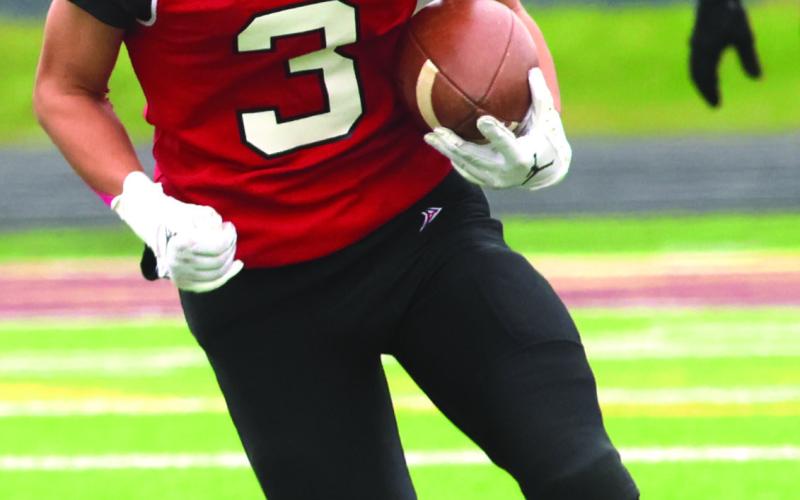 Trenten Keena returns the opening kickoff in Saturday’s game.