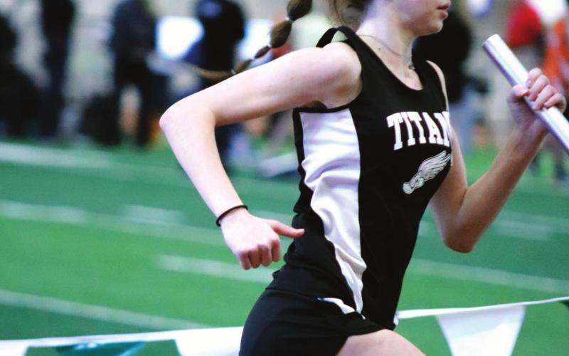 Elizabeth Fedje running in the Girls 1200 Meter Relay. VNV photo by Lyle Van Camp