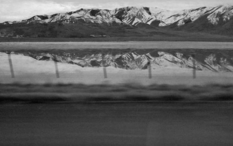 Scene along I-80 West; Mountain Range reflected by water. Photo submitted by Clint Van Camp