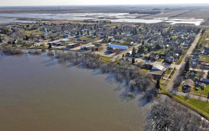 Drone flood picture taken by Travis Uggerud last Wednesday while patrolling the dikes in Drayton shows the town looking slightly like an island just before the river reached its crest last week.