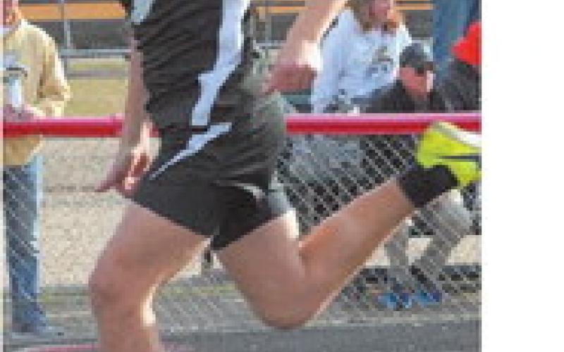 Titan Samuel Kittelson pressing for a strong finish. Photo by Larry Stokke.