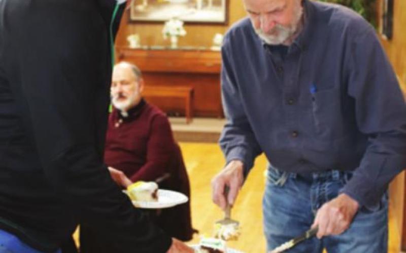 Brad Schuster and Randy Emanuelson served cake and coffee to those who gathered for Danny’s retirement celebration. VNV photo by Lyle Van Camp
