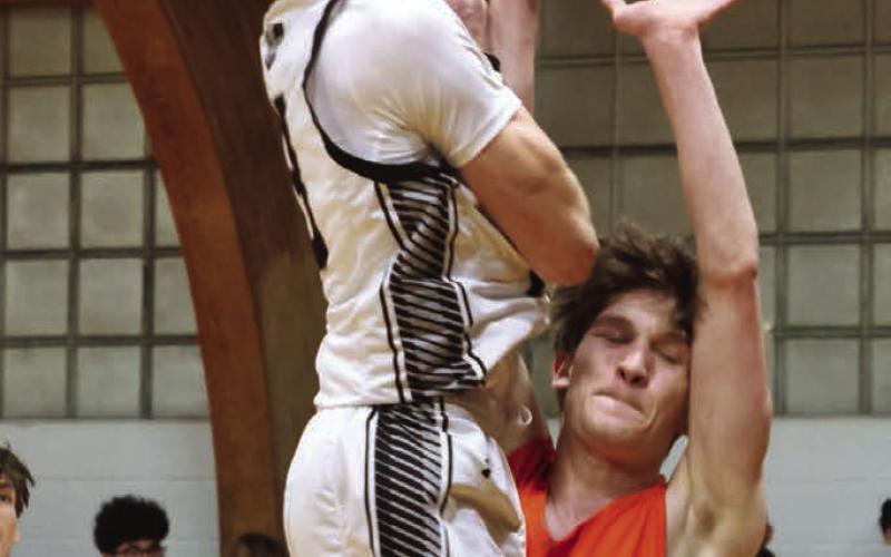 Connor Hurtt goes up for two against Larimore's Russell McLean.
