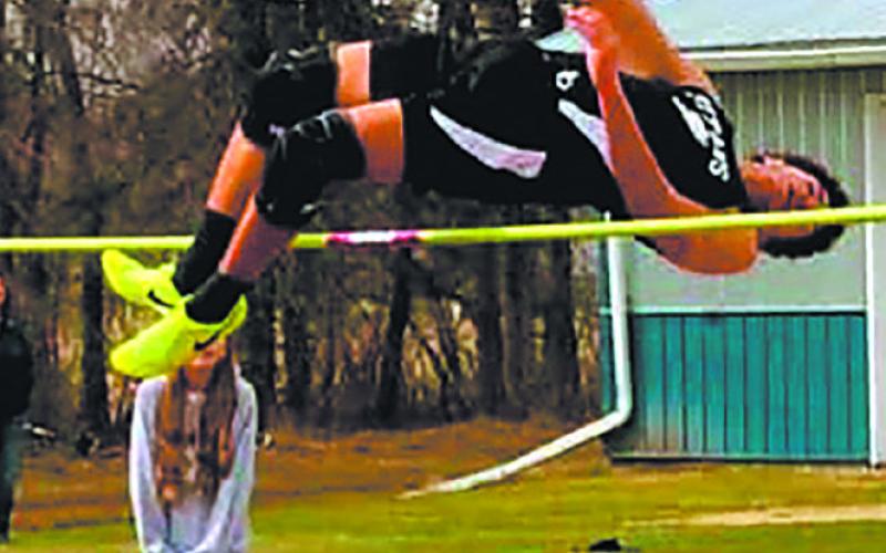 Mason Pollestad clears the high jump at the HCV meet, setting a new personal record at 5' 8'. Photo by Jamie Rarick