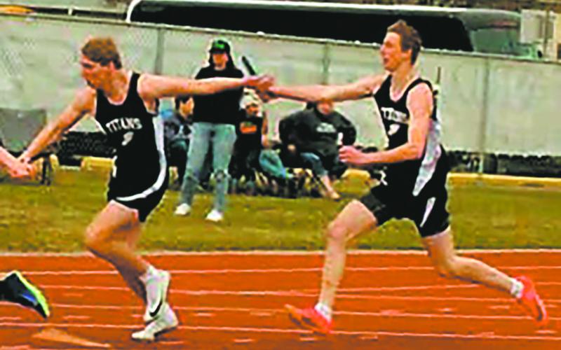 In the boys 4x200 relay at the HCB meet, Carter Johnson receives the baton from Jack Langerud. Along with Carter Oberg and Brady Reilly the team took first in the event, setting a new PR at 1:36.03. Photo by Jamie Rarick