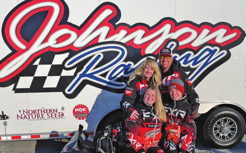 Johnson family in front of the Johnson Racing trailer. Pictured back row left to right: Amber and Scott Johnson. Front row: Madison Philips and Hunter Johnson. Photo submitted by Johnson Family