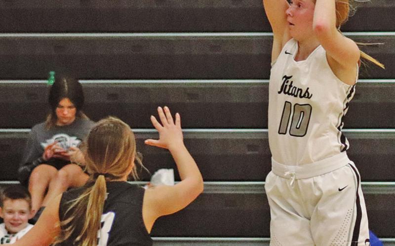 Easton Larson makes a three point attempt against Hatton Northwood in Drayton Thursday night. VNV photo by Lesa Van Camp