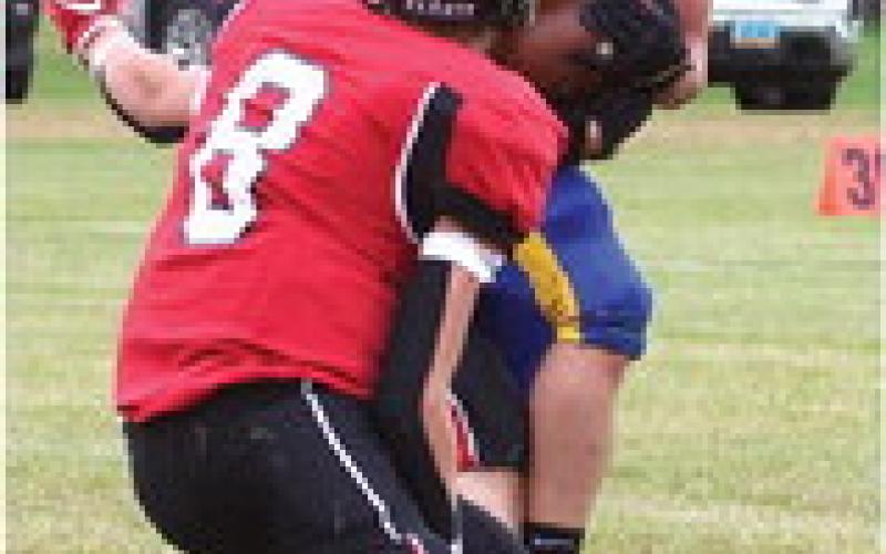 Jamie Laroque and Gavin Ryan tie up the Trenton ball carrier.