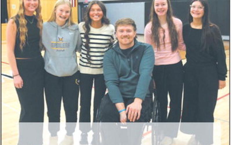 Peyton Larson, Nulla Thompson, Mikala Mccoy, Jocelyn Vold, and Maia Hermanson shared a moment with Hunter Pinke following Thursday's visit. There was a good-natured rivalry before the evening's game against Hatton Northwood, where Pinke’s sisters play basketball. Photo by Jamie Rarick