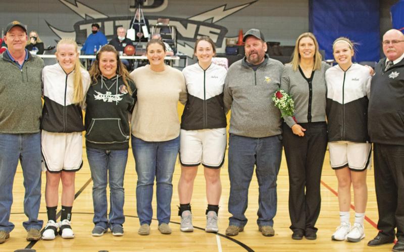 Senior Parents Night was held in the Drayton gym last Monday night. Pictured left to right are Titans Girls Basketball players along with their parents: Mike Lorton, Meghan Lorton, Deena Vigen-Lorton, Jessica Hermanson, Madison Hermanson, Mark Hermanson, Kerr; Stegman, Kasey Stegman, and Wayne Stegman. VNV Photo by Lesa Van Camp