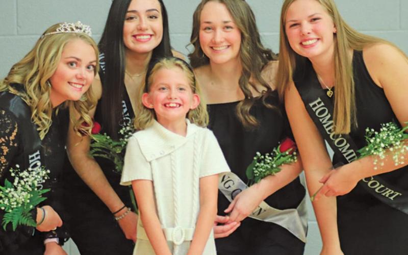 Following the ceremony there was a time for taking pictures. Pictured above left to right: is a possible future homecoming Queen posing for a picture with part of this years royalty Aliyah Bartles, Leslie Pena, Ruthie Rarick (in front), Queen Madison Hermanson, and Kasey Stegman. VNV Photo by Lesa Van Camp