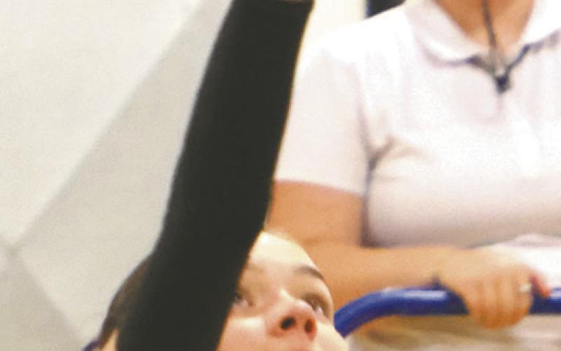 Elizabeth Fedje puts down a kill for one of the last points of the match. Photo by Lyle Van Camp