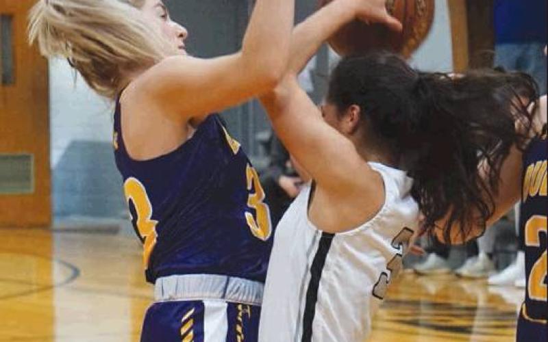 Grace Kertz fights for control of the ball with a Rolla defender. VNV Photo by Lesa Van Camp