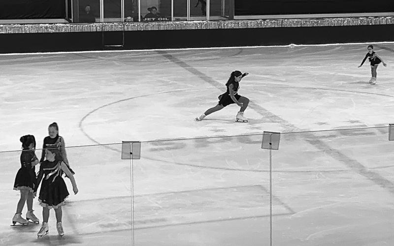 Amelia glides across the ice during the Basic 5 portion of the Grafton Figure Skating Show, “Go for Gold.” Photo by Rebecca Davis