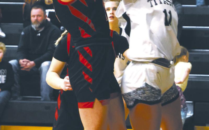 Jacey Nelson's shot is blocked by a Mustang defender. Photo by Lyle Van Camp