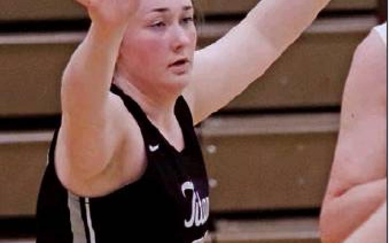 Pictured left: Madison Hermanson guards a Spoilers player to keep them from getting to the basket last Tuesday night. VNV Photo by Lesa Van Camp